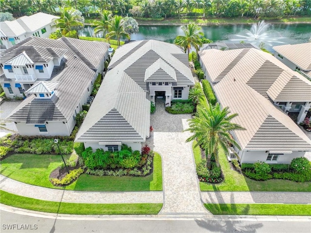 birds eye view of property with a water view