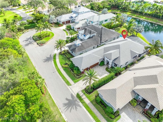 birds eye view of property with a water view