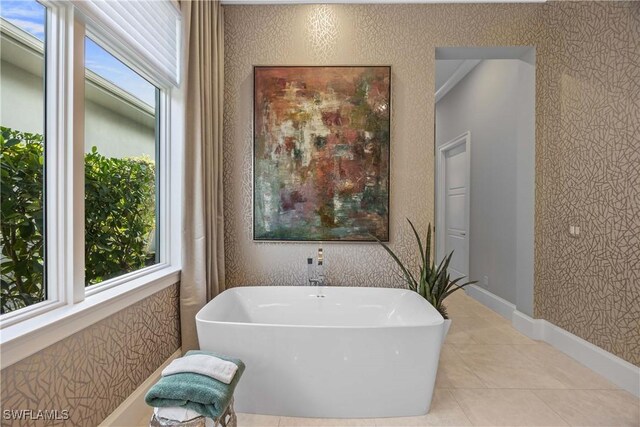 bathroom featuring tile patterned floors and a bathtub