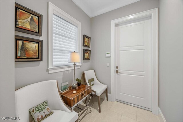 living area featuring light tile patterned flooring