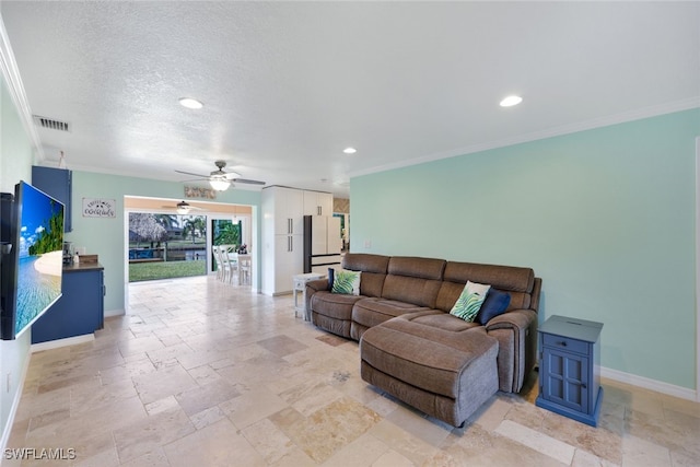 living room featuring ceiling fan and ornamental molding