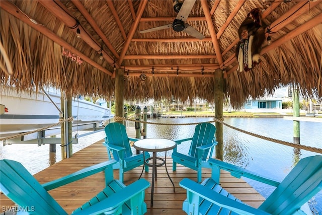 view of dock featuring a gazebo and a water view