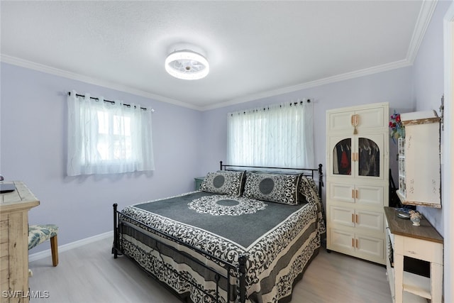 bedroom featuring wood-type flooring, crown molding, and multiple windows