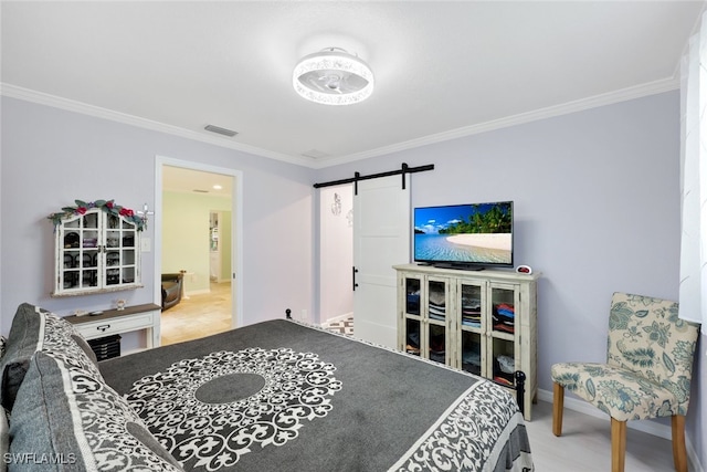 carpeted bedroom with a barn door and ornamental molding