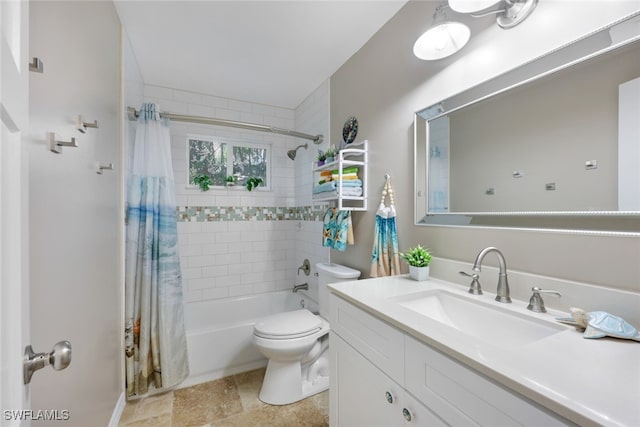 full bathroom with vanity, shower / tub combo, and toilet