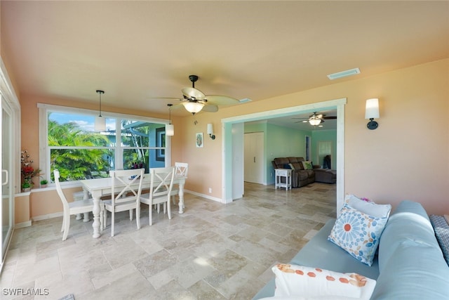 interior space featuring an outdoor living space and ceiling fan