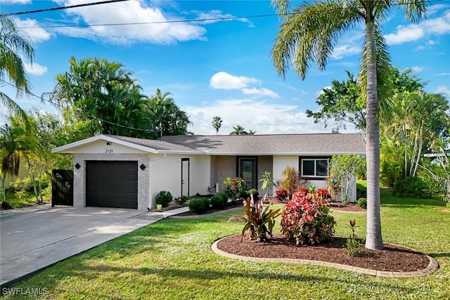 ranch-style house with a front yard and a garage