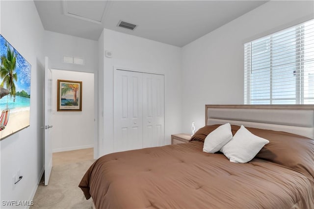 carpeted bedroom featuring a closet