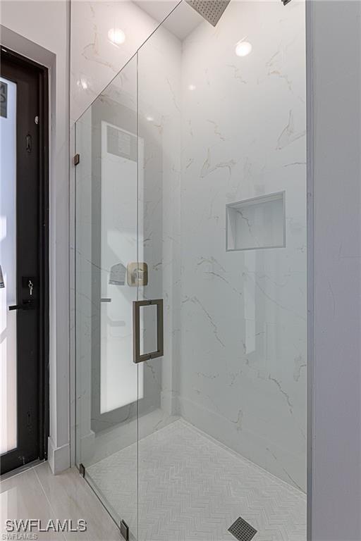 bathroom featuring an enclosed shower