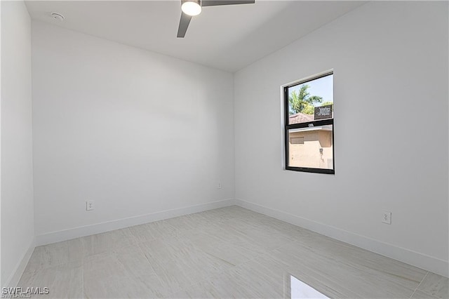 spare room with ceiling fan