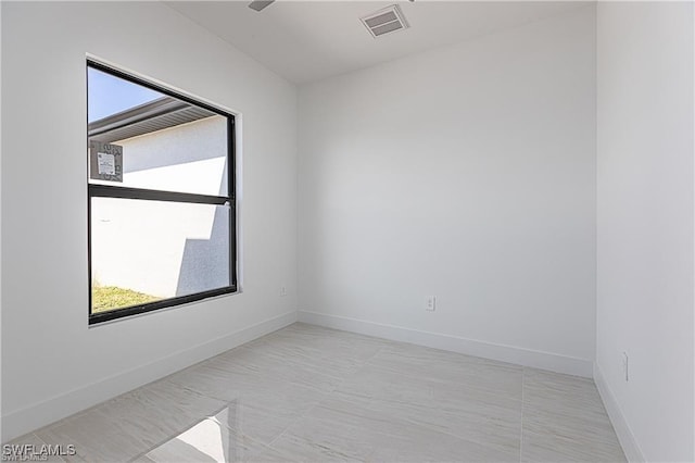 empty room featuring light tile patterned flooring