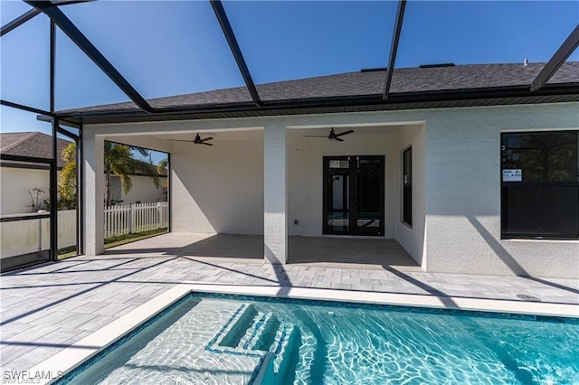 view of pool featuring ceiling fan, a lanai, and a patio