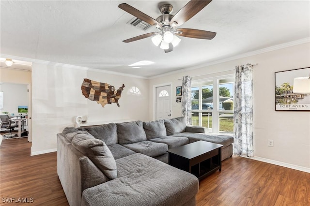 living room featuring crown molding, dark hardwood / wood-style floors, and ceiling fan