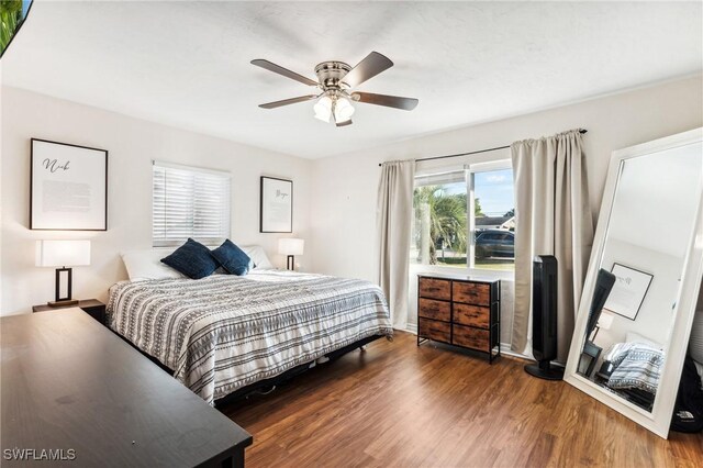 bedroom featuring dark wood-type flooring and ceiling fan