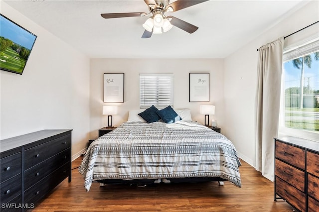 bedroom with hardwood / wood-style flooring and ceiling fan