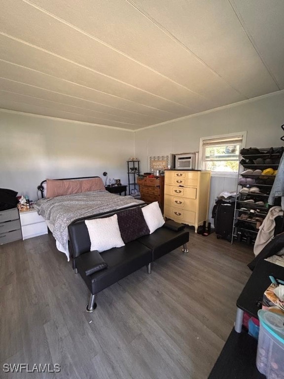 bedroom with dark wood-type flooring