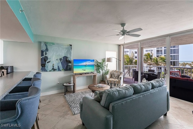 living room featuring ceiling fan and light tile patterned floors