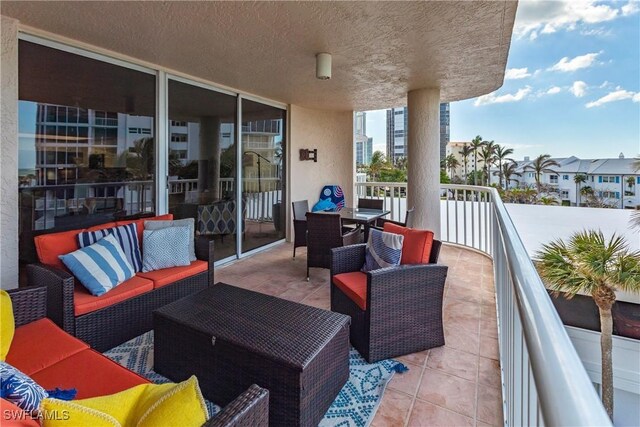 view of patio with a balcony and an outdoor hangout area