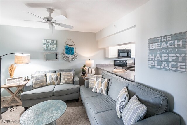 carpeted living room featuring ceiling fan