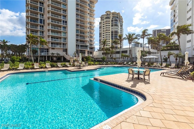 view of swimming pool featuring a patio area