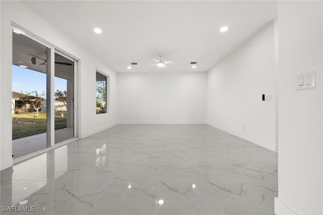 unfurnished room with ceiling fan