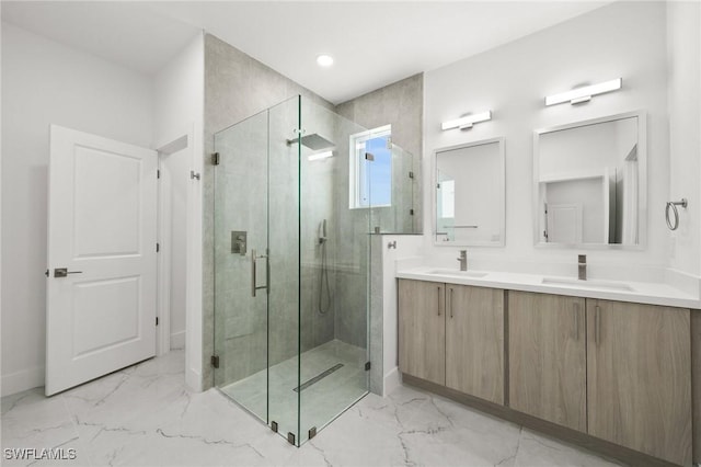 bathroom featuring vanity and a shower with shower door