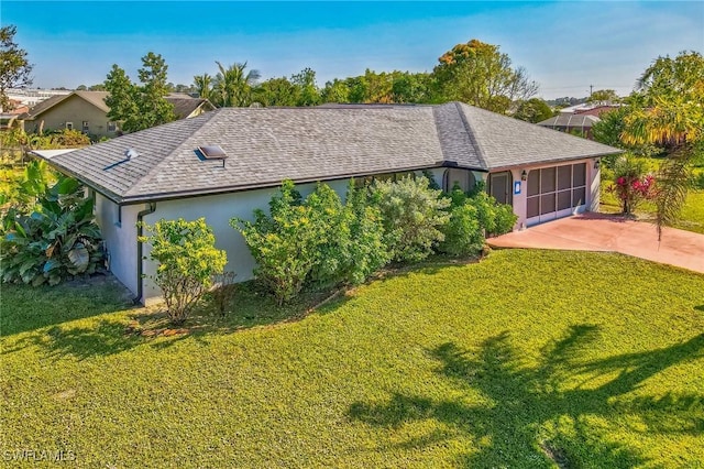 view of front of property with a front lawn and a garage