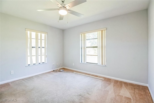 empty room with carpet floors and ceiling fan