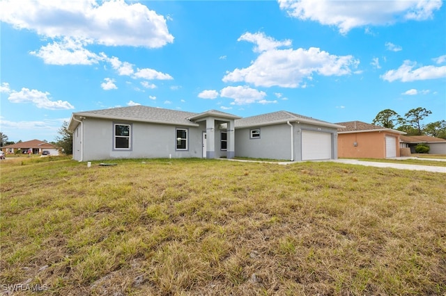 ranch-style house with a front lawn and a garage