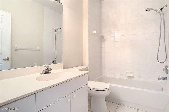 full bathroom featuring tile patterned floors, tiled shower / bath combo, toilet, and vanity