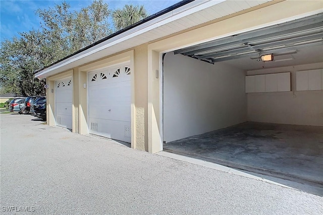 garage featuring a garage door opener