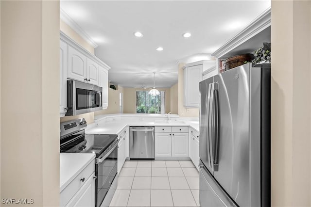 kitchen with white cabinetry, sink, stainless steel appliances, decorative light fixtures, and light tile patterned floors