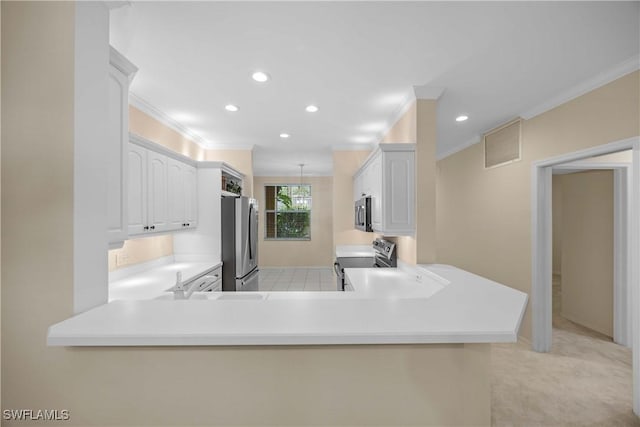 kitchen with kitchen peninsula, appliances with stainless steel finishes, white cabinets, and light carpet