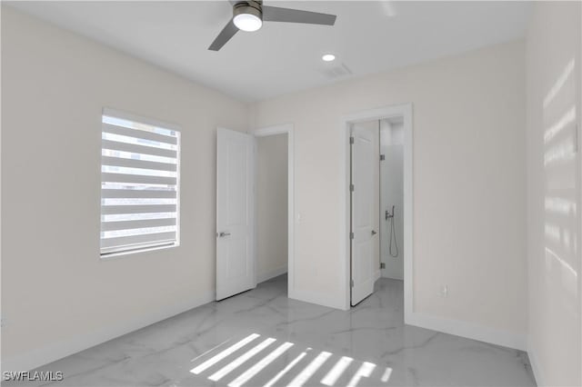 unfurnished bedroom with ceiling fan, connected bathroom, and a closet