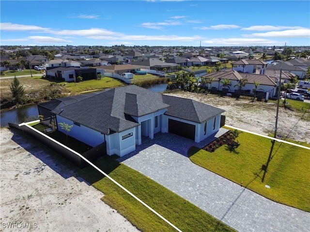 drone / aerial view with a water view