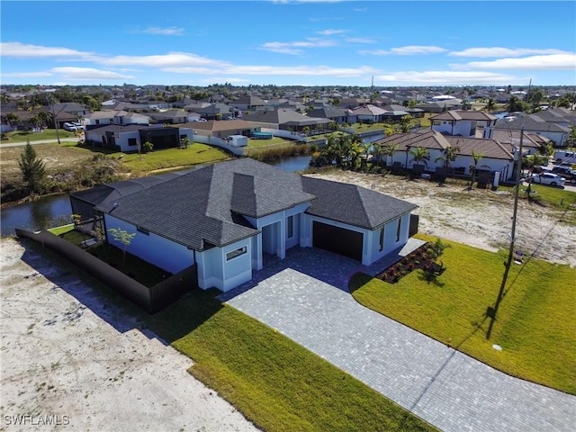 drone / aerial view featuring a water view