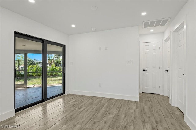 unfurnished room featuring light hardwood / wood-style flooring