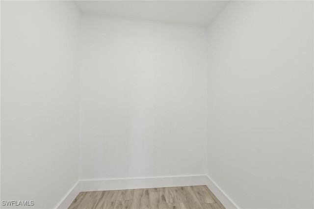 unfurnished room with light hardwood / wood-style floors