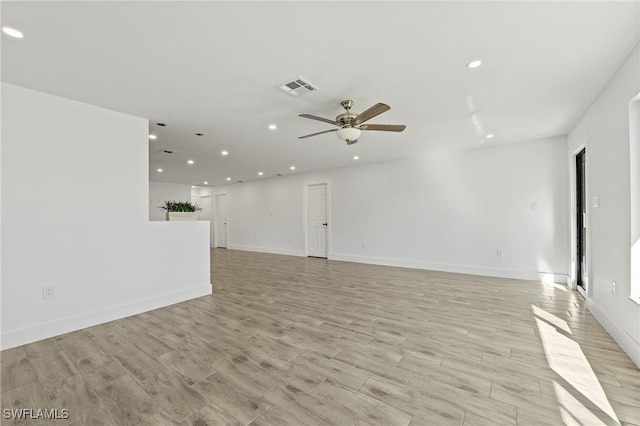 unfurnished living room featuring light wood-type flooring and ceiling fan