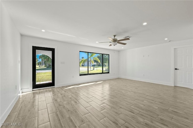 unfurnished room with light hardwood / wood-style floors and ceiling fan