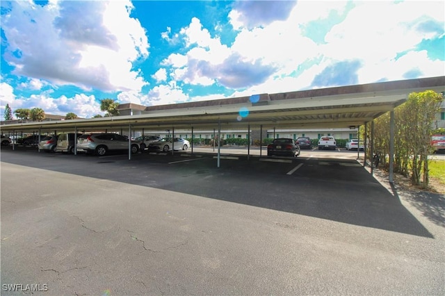 view of parking / parking lot with a carport