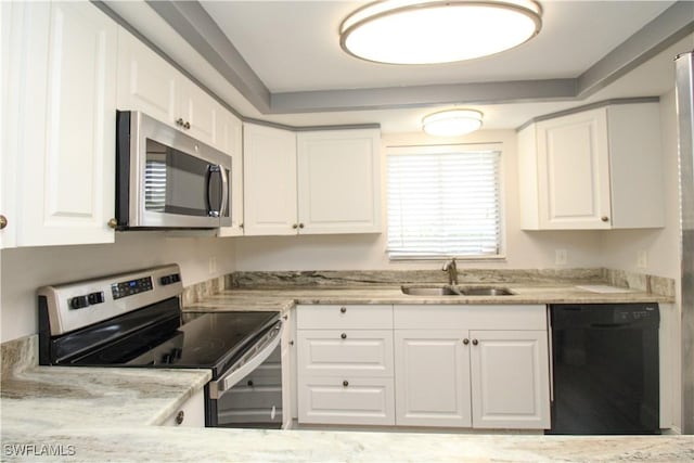 kitchen featuring sink, white cabinetry, and stainless steel appliances