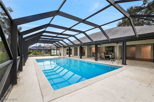 2037 Prince Dr, Naples, FL 34110 - outdoor pool featuring a patio area, ceiling fan, and glass enclosure