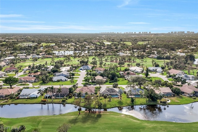 bird's eye view with view of golf course, a water view, and a residential view