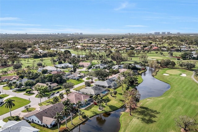 birds eye view of property featuring a residential view, a water view, and view of golf course