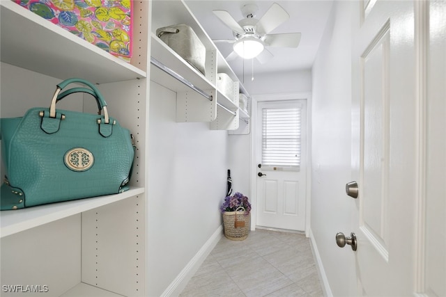 2037 Prince Dr, Naples, FL 34110 - spacious closet featuring ceiling fan and light tile patterned flooring