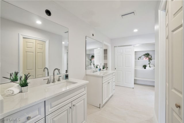 bathroom featuring vanity, recessed lighting, and visible vents