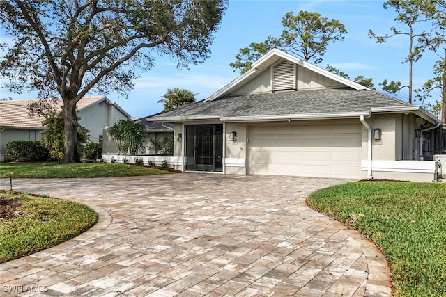 single story home with stucco siding, a front lawn, decorative driveway, roof with shingles, and a garage