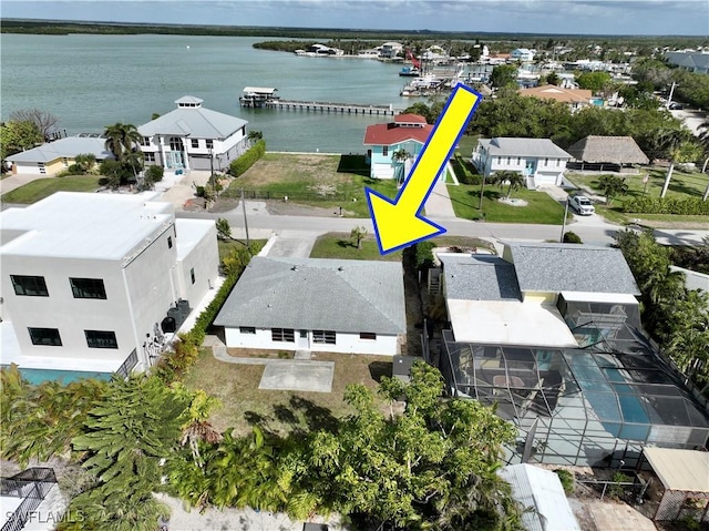 birds eye view of property featuring a water view