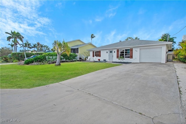 ranch-style home with a garage and a front lawn